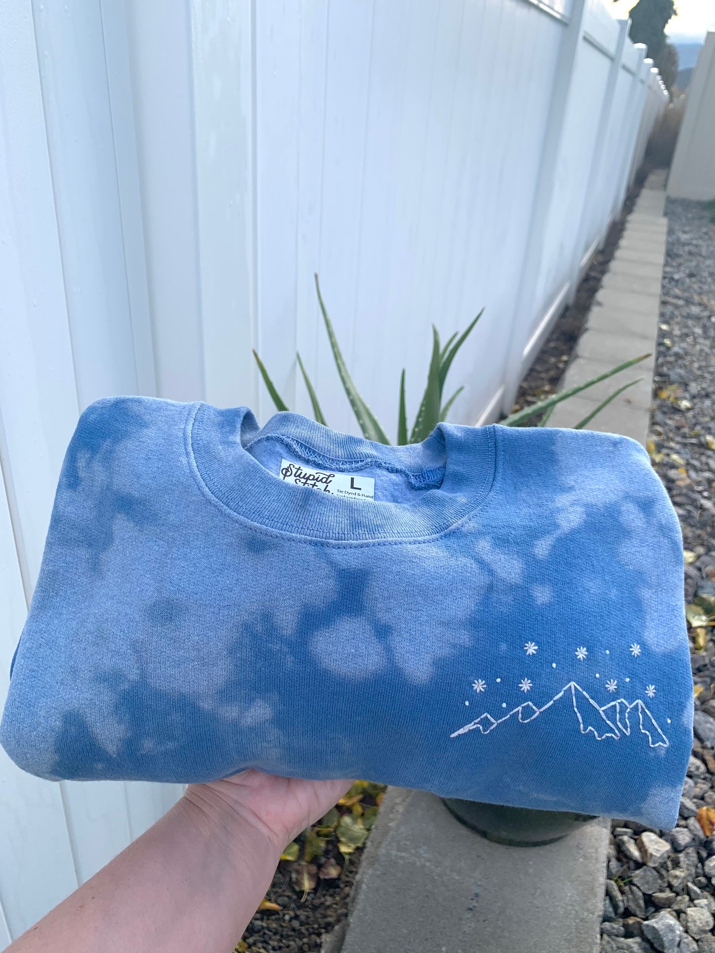 Made to Order Starry Snowy Mountain Range Hand Embroidery – Unisex Light Blue Tie-Dye Fleece Sweatshirt