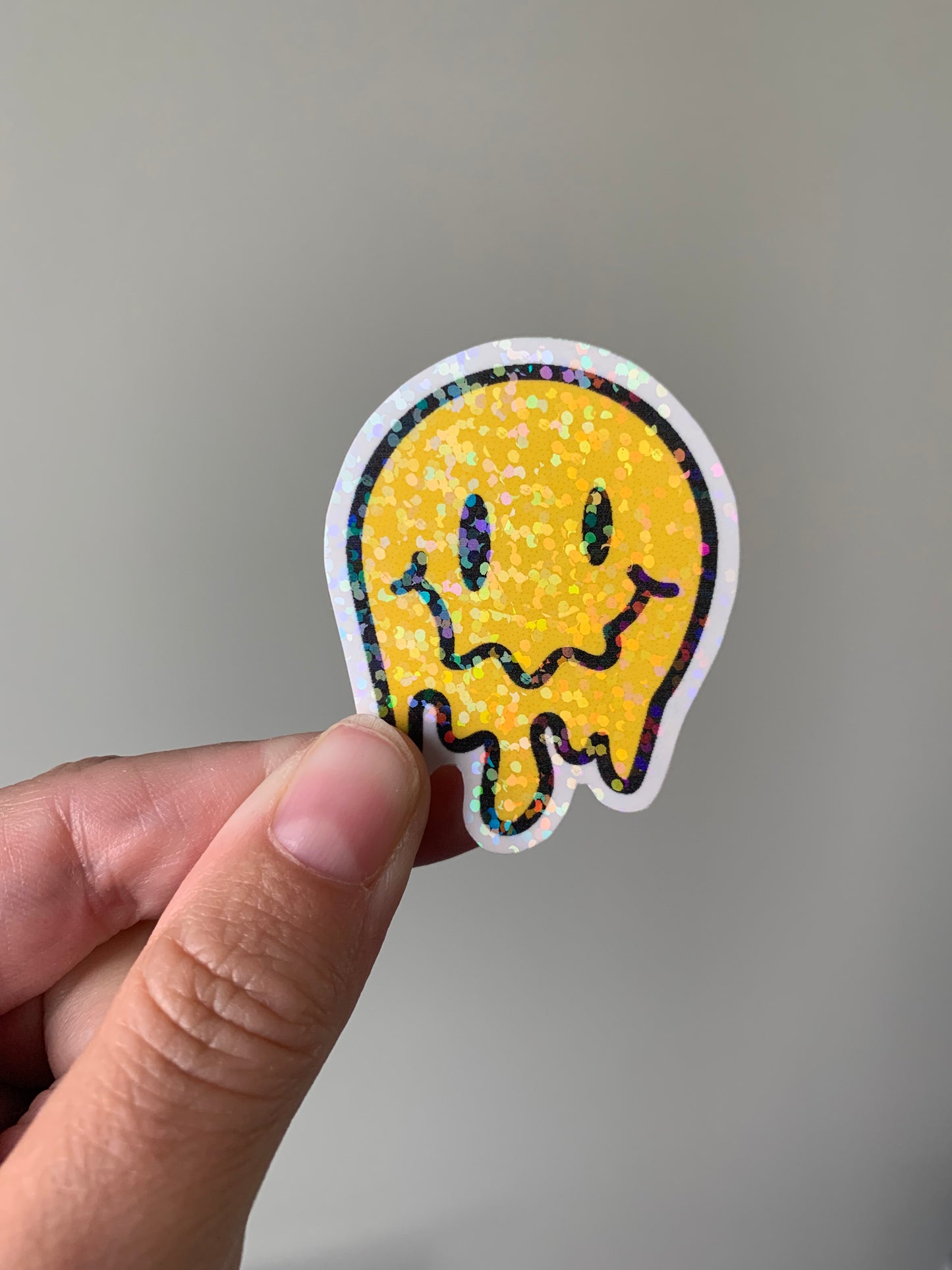 Melting Yellow and Checkered Smiley Face Sticker