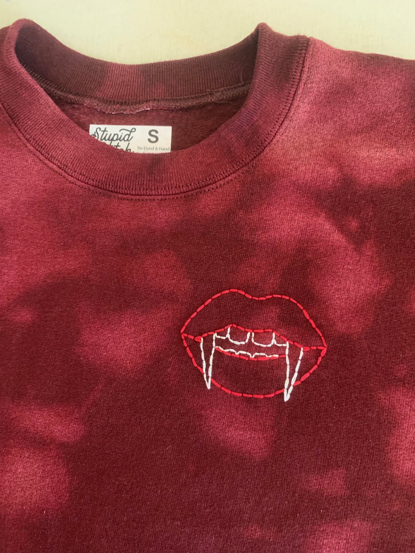 Hand Embroidered Vampire Lips with Bat Coffin on Tie Dye Maroon Fleece Long Sleeve Crew