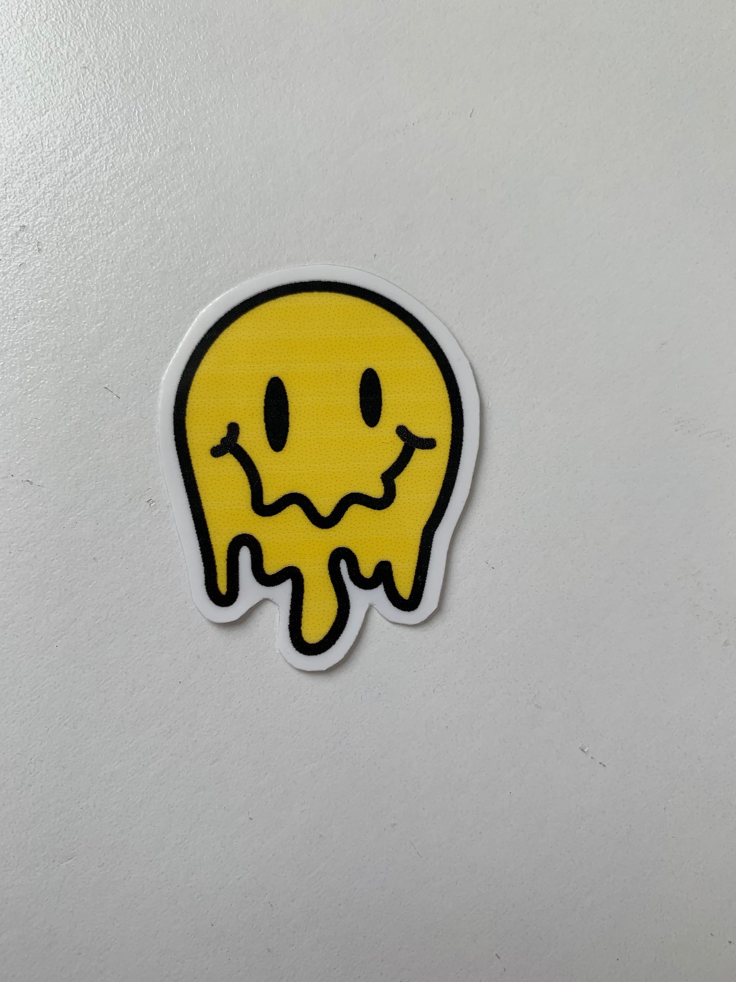 Melting Yellow and Checkered Smiley Face Sticker