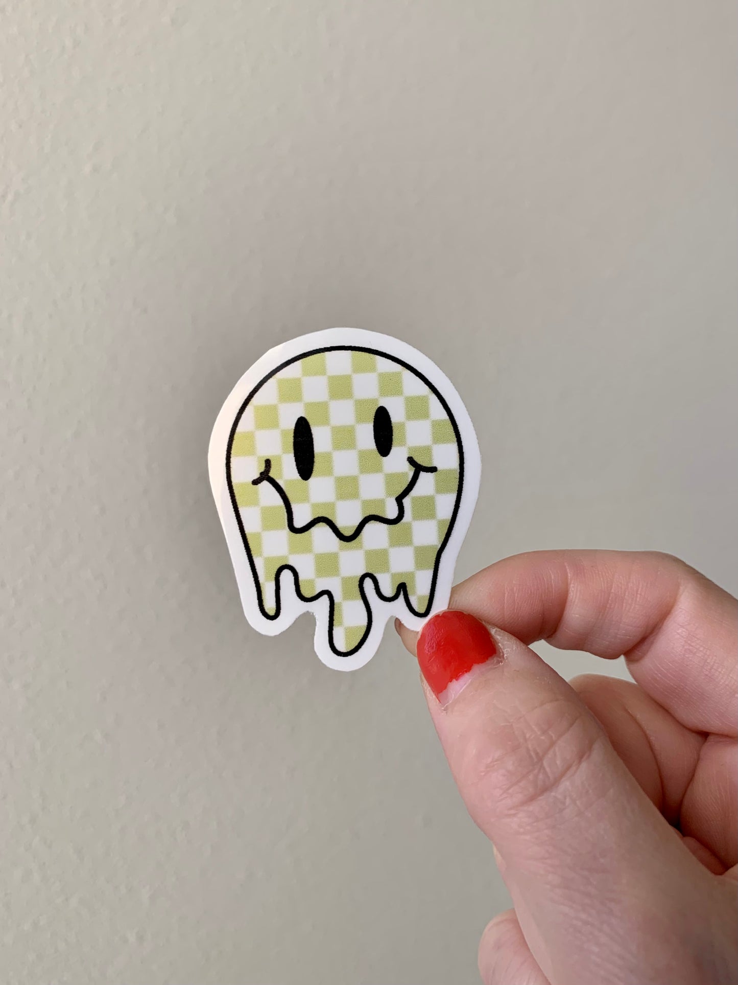 Melting Yellow and Checkered Smiley Face Sticker