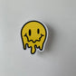 Melting Yellow and Checkered Smiley Face Sticker