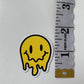 Melting Yellow and Checkered Smiley Face Sticker
