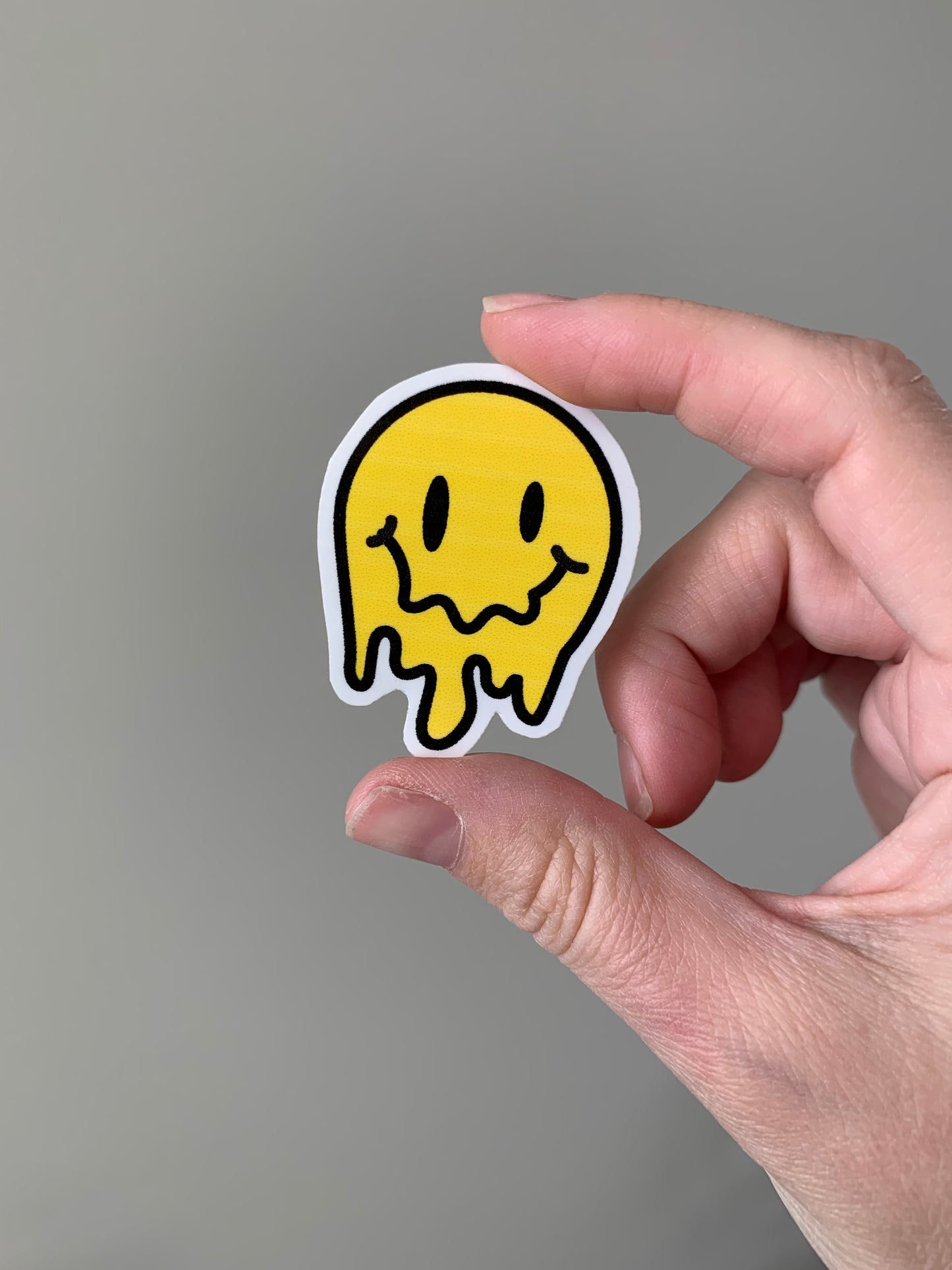 Melting Yellow and Checkered Smiley Face Sticker