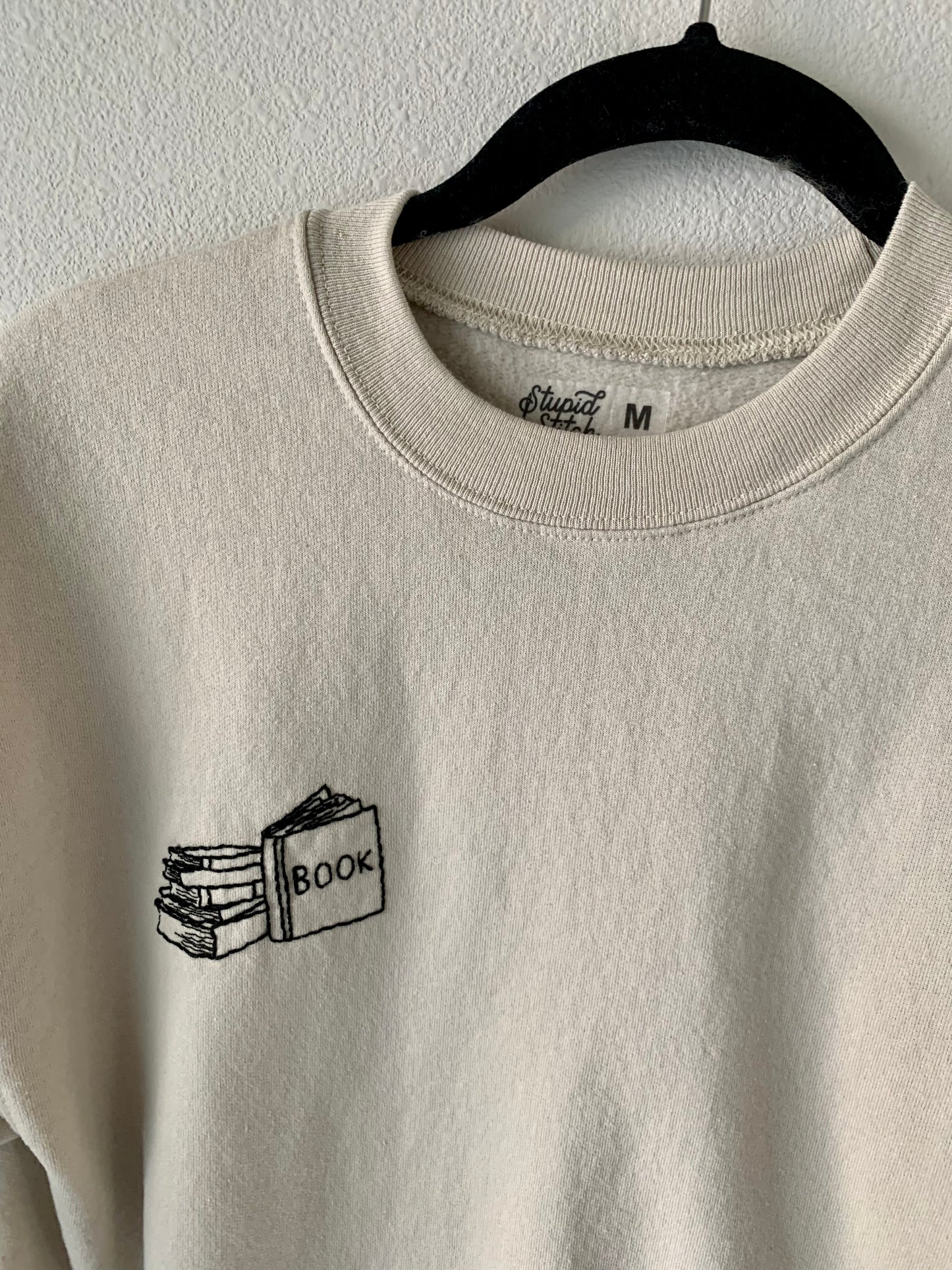 Made to Order Hand Embroidered Book Stack with Open Book on Sleeve, Tan Crewneck Fleece Long Sleeve Pullover Sweatshirt, Unisex, Bookstagram